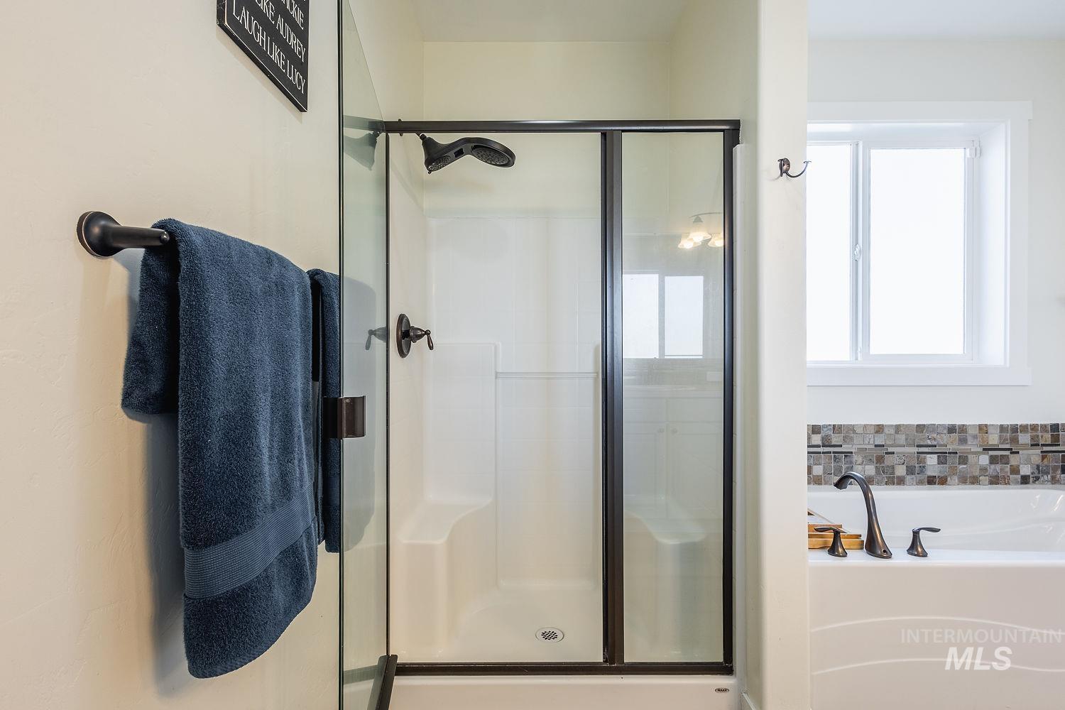 1332 West Raelin Drive Nampa, ID 83686 - Photo 30 of 48 Bathroom with a garden tub and a stall shower