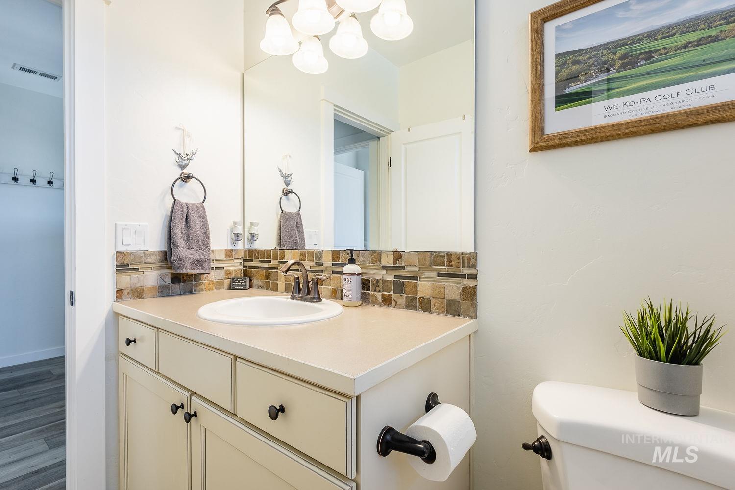 1332 West Raelin Drive Nampa, ID 83686 - Photo 35 of 48 Bathroom featuring vanity and tasteful backsplash