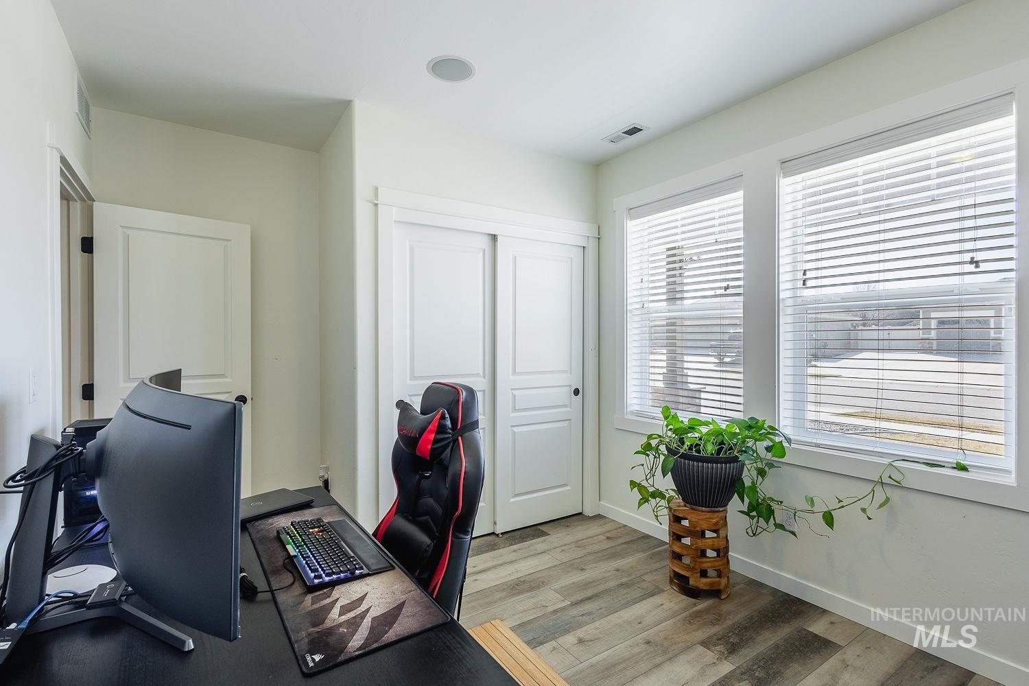 1332 West Raelin Drive Nampa, ID 83686 - Photo 37 of 48 Home office featuring light wood-type flooring and baseboards