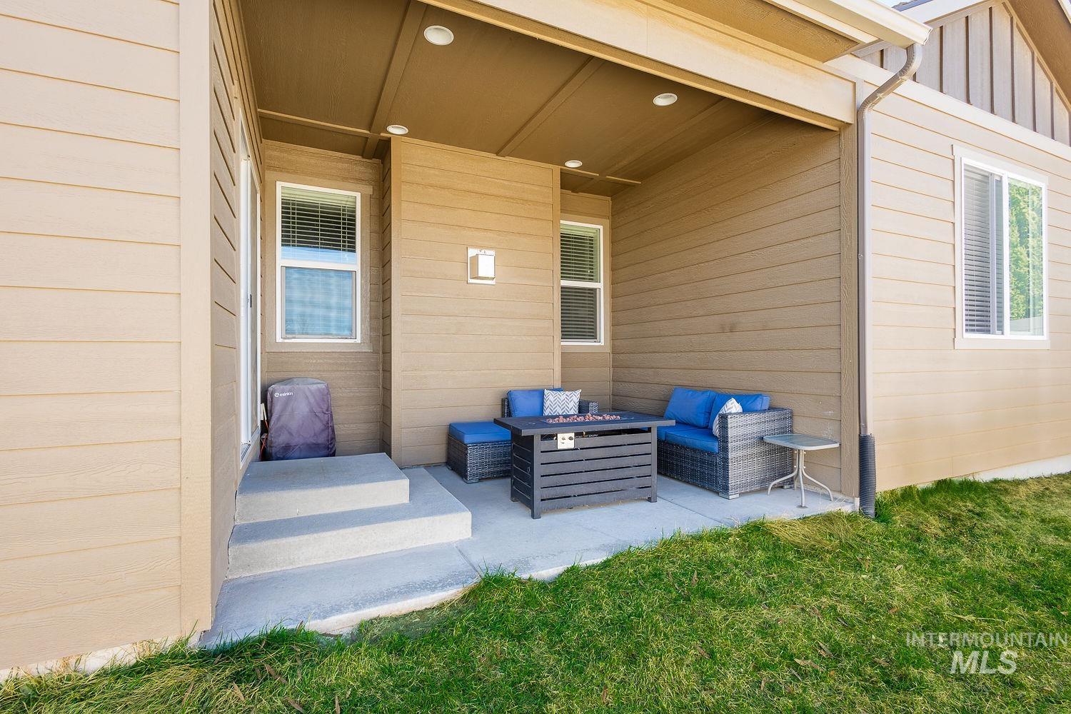 1332 West Raelin Drive Nampa, ID 83686 - Photo 43 of 48 View of patio / terrace with an outdoor living space with a fire pit