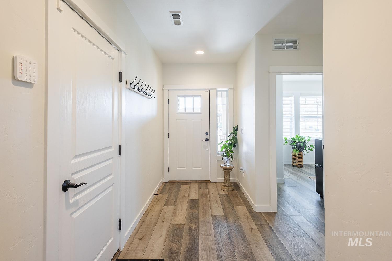 1332 West Raelin Drive Nampa, ID 83686 - Photo 6 of 48 Doorway featuring hardwood / wood-style flooring and recessed lighting