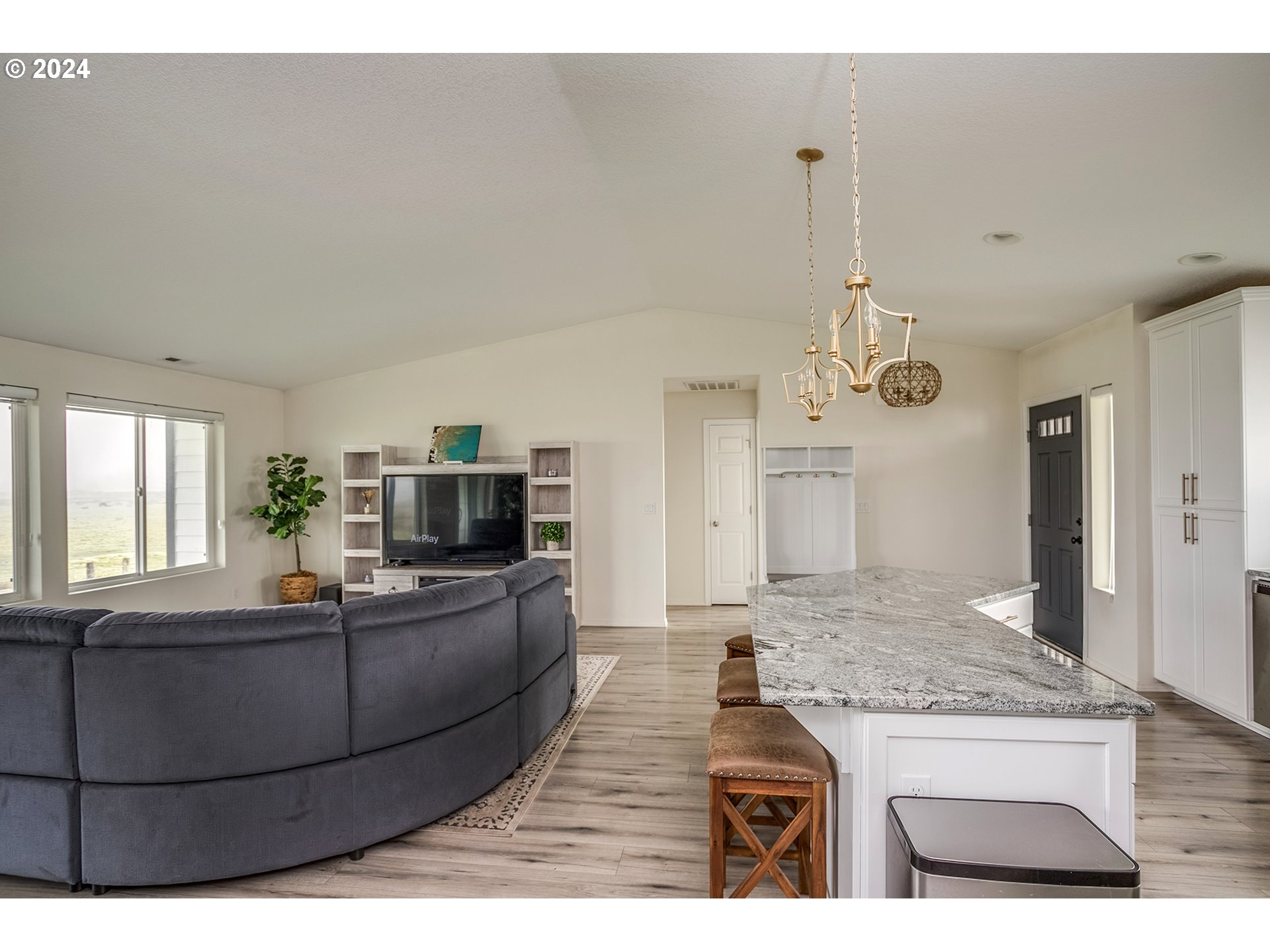 92597 Wireless Road Astoria, OR 97103 - Photo 13 of 35 a living room with furniture and a kitchen counter top