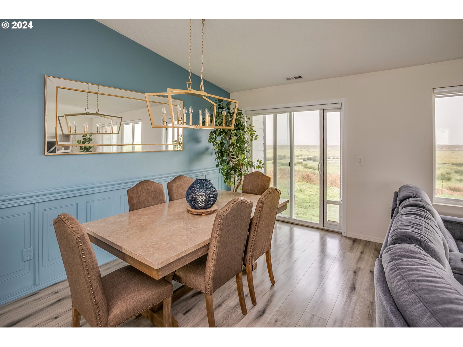 92597 Wireless Road Astoria, OR 97103 - Photo 14 of 35 a view of a dining room with furniture window and wooden floor