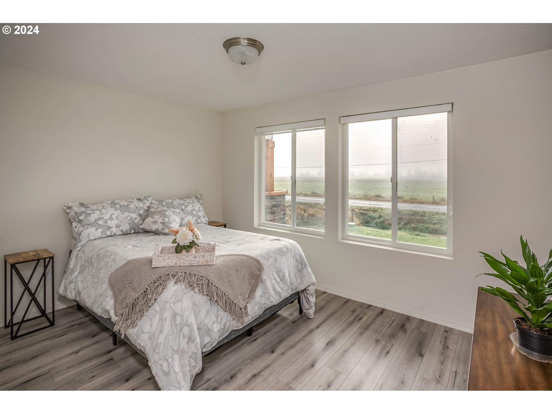 92597 Wireless Road Astoria, OR 97103 - Photo 15 of 35 a bedroom with a bed and wooden floor