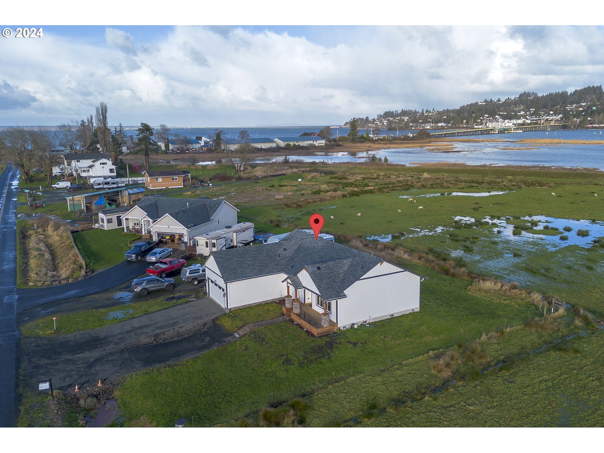 92597 Wireless Road Astoria, OR 97103 - Photo 24 of 35 a picture of a lake with couches and city view