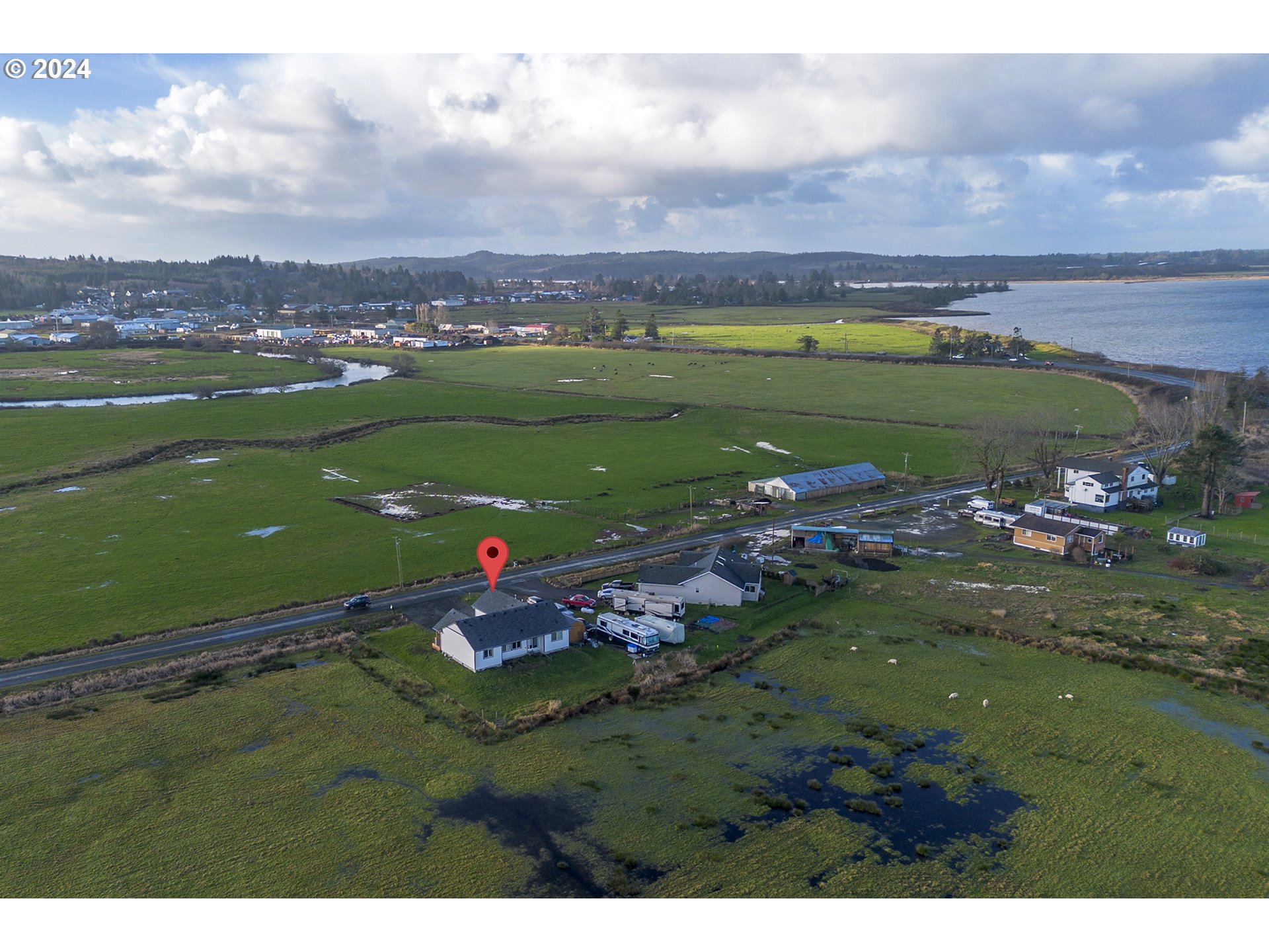 92597 Wireless Road Astoria, OR 97103 - Photo 27 of 35 a view of a golf course with a lake