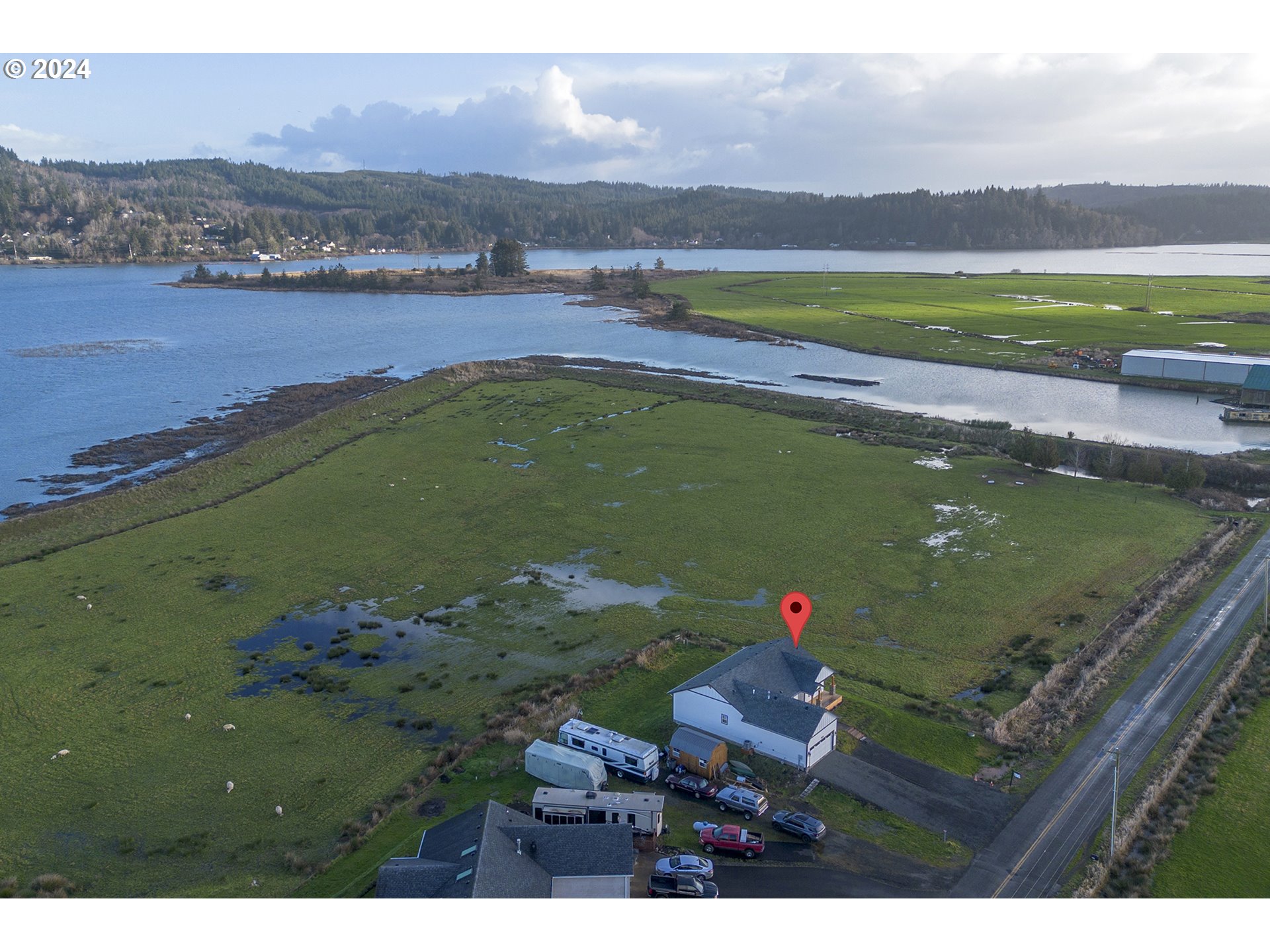 92597 Wireless Road Astoria, OR 97103 - Photo 30 of 35 an aerial view of a house with a lake view