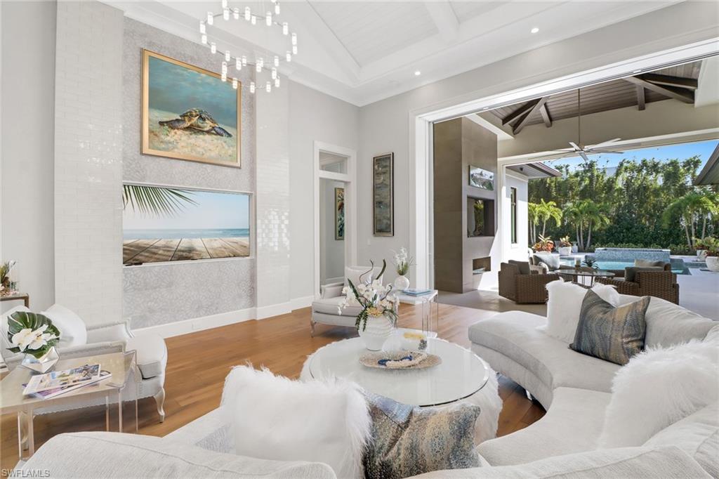636 Portside Drive Naples, FL 34103 - Photo 29 of 50 a living room with furniture and a large window
