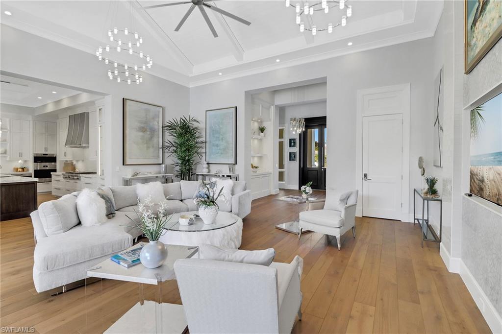 636 Portside Drive Naples, FL 34103 - Photo 30 of 50 a living room with furniture and a chandelier