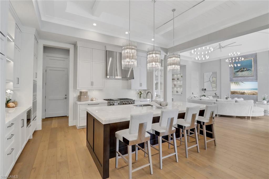 636 Portside Drive Naples, FL 34103 - Photo 3 of 50 a large kitchen with lots of counter space and appliances