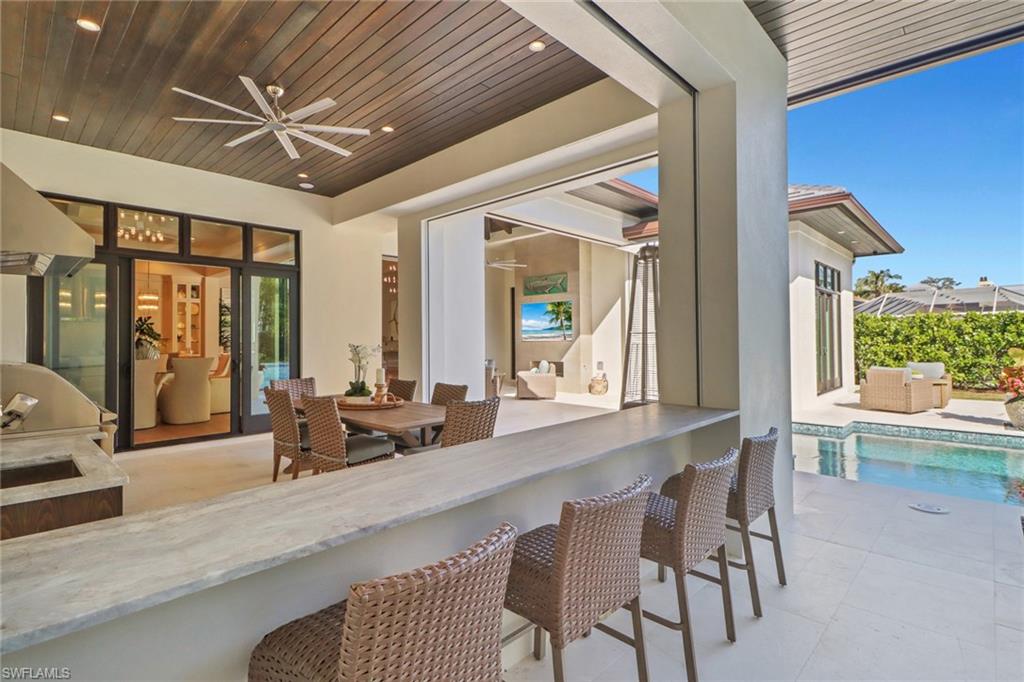 636 Portside Drive Naples, FL 34103 - Photo 36 of 50 a view of a dining room with furniture window and outside view