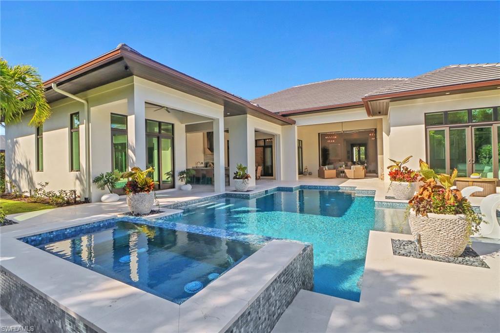 636 Portside Drive Naples, FL 34103 - Photo 40 of 50 a view of a house with patio