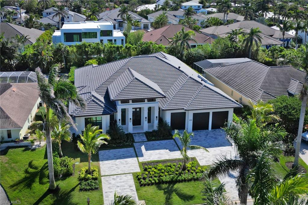 636 Portside Drive Naples, FL 34103 - Photo 44 of 50 an aerial view of a house with yard patio and green space