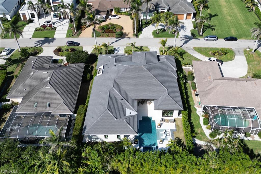 636 Portside Drive Naples, FL 34103 - Photo 46 of 50 an aerial view of multiple houses with a yard