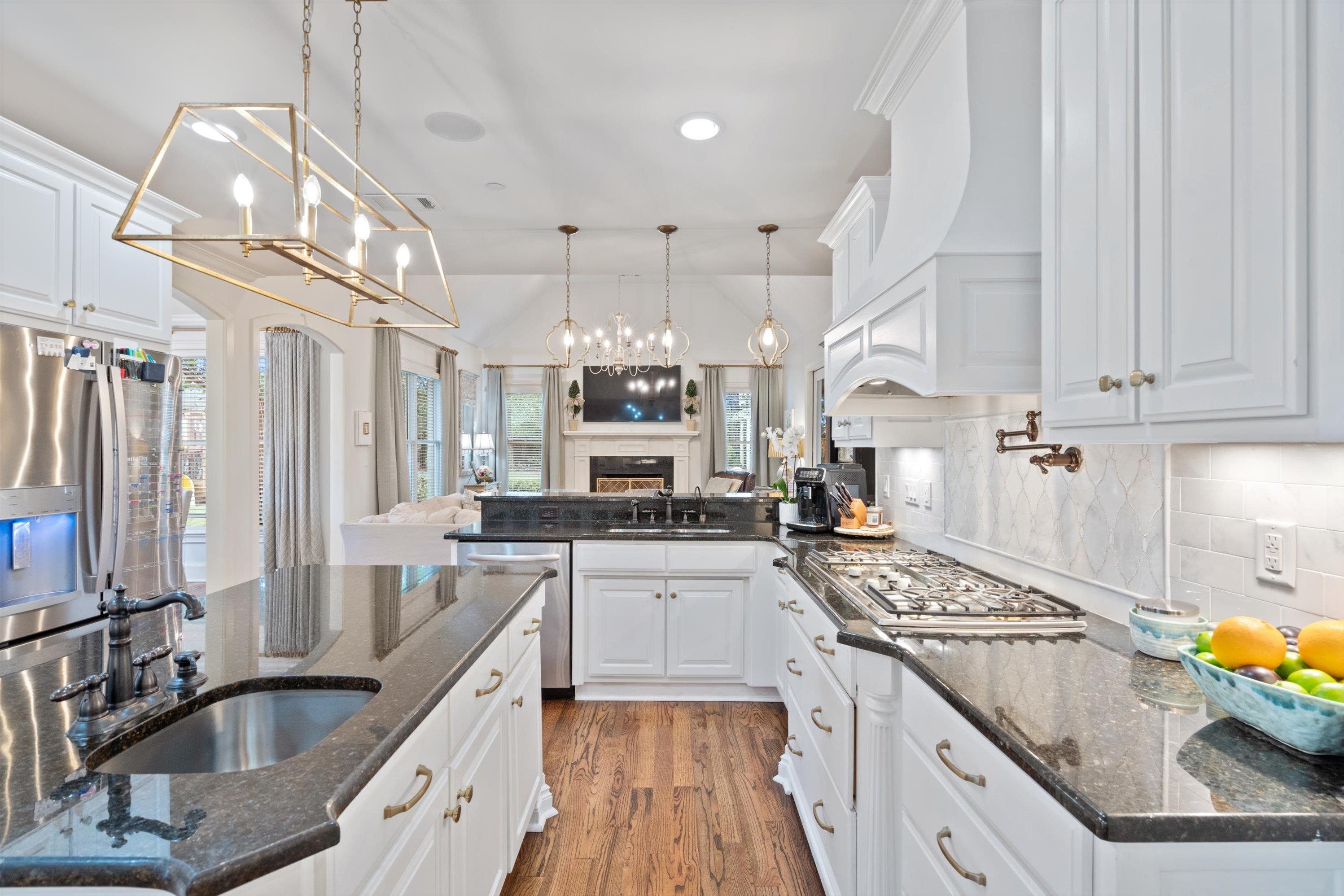 4621 Spring Meadow Way North Olive Branch, MS 38654 - Photo 10 of 40 a kitchen with stainless steel appliances granite countertop a sink stove and refrigerator