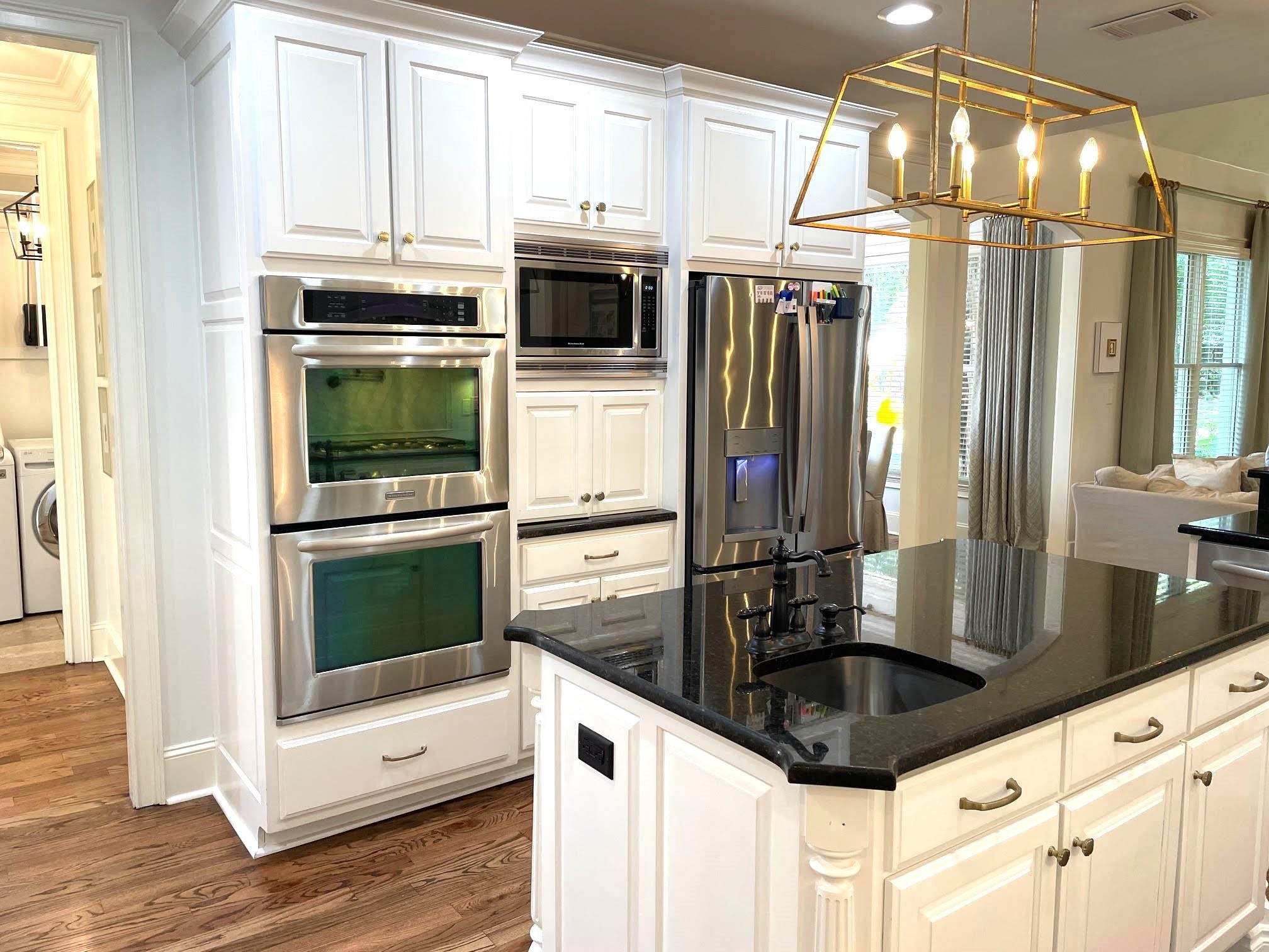 4621 Spring Meadow Way North Olive Branch, MS 38654 - Photo 13 of 40 a kitchen with stainless steel appliances a stove a microwave and a refrigerator