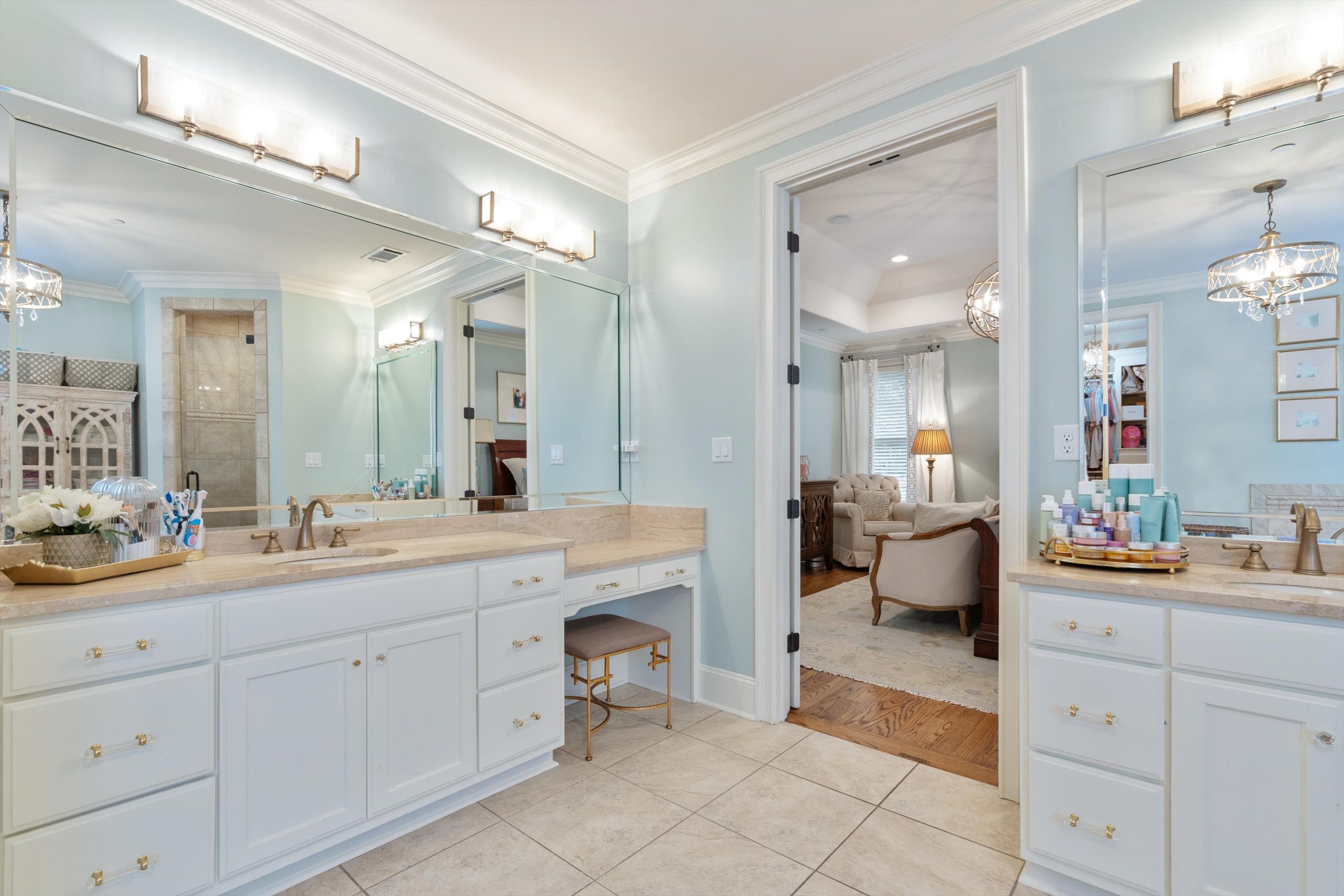 4621 Spring Meadow Way North Olive Branch, MS 38654 - Photo 19 of 40 a large white bathroom with a double vanity sink mirror and