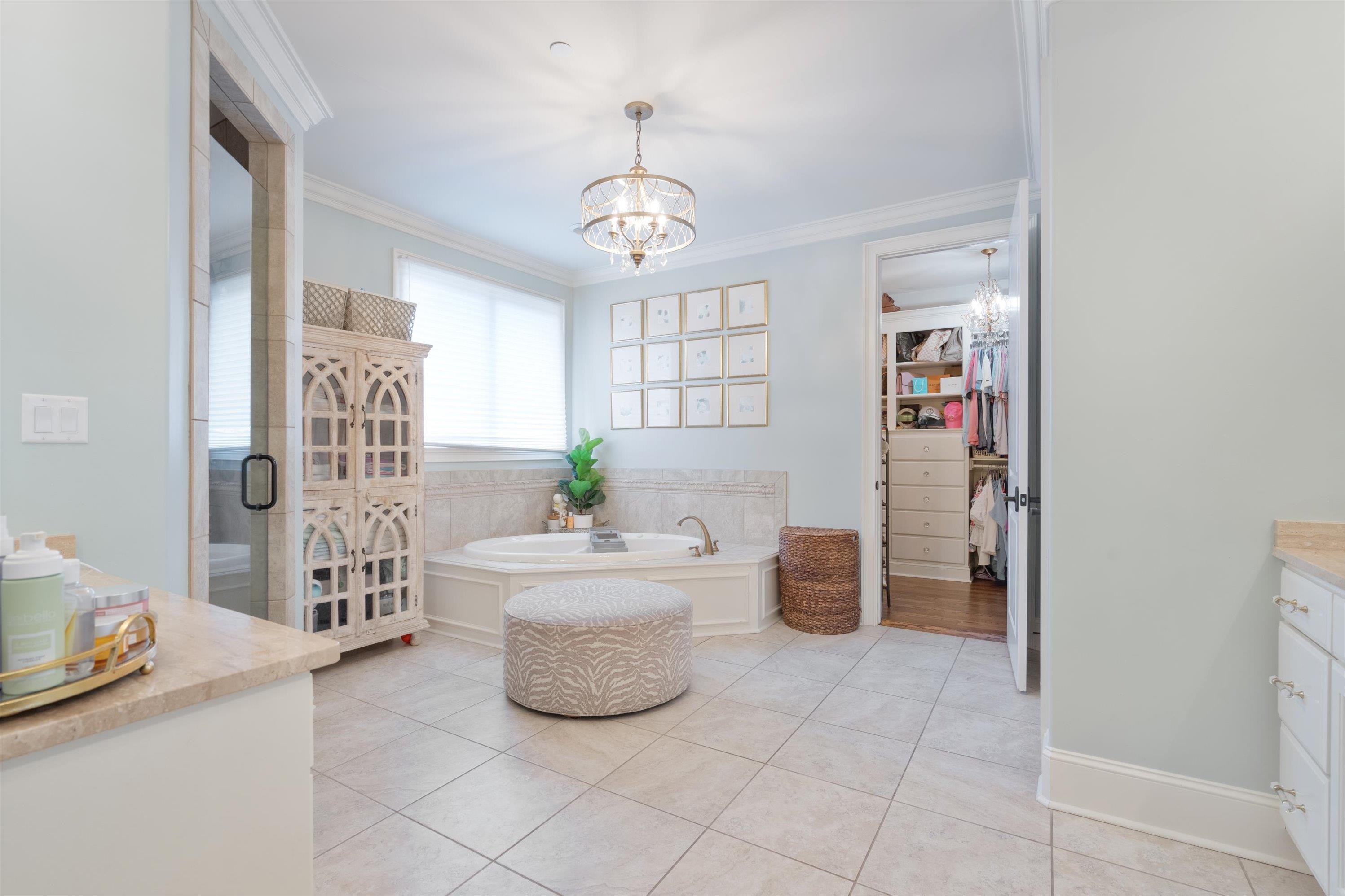 4621 Spring Meadow Way North Olive Branch, MS 38654 - Photo 20 of 40 a living room with furniture and a chandelier
