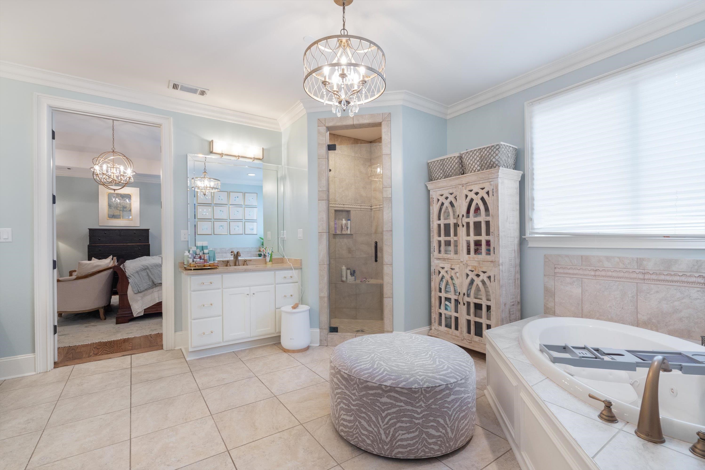 4621 Spring Meadow Way North Olive Branch, MS 38654 - Photo 21 of 40 a spacious bathroom with a tub sink and shower