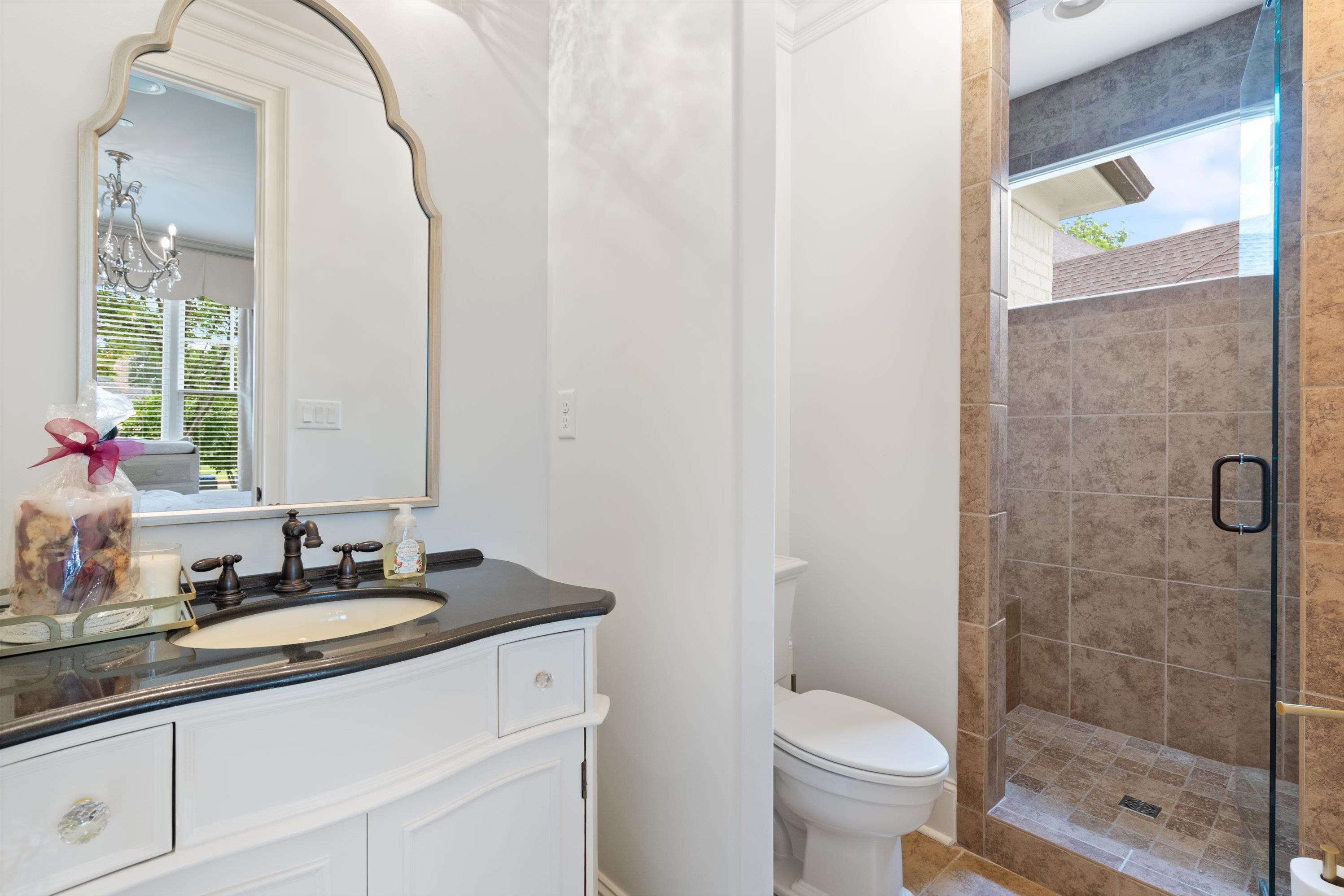 4621 Spring Meadow Way North Olive Branch, MS 38654 - Photo 23 of 40 a bathroom with a granite countertop sink toilet and shower