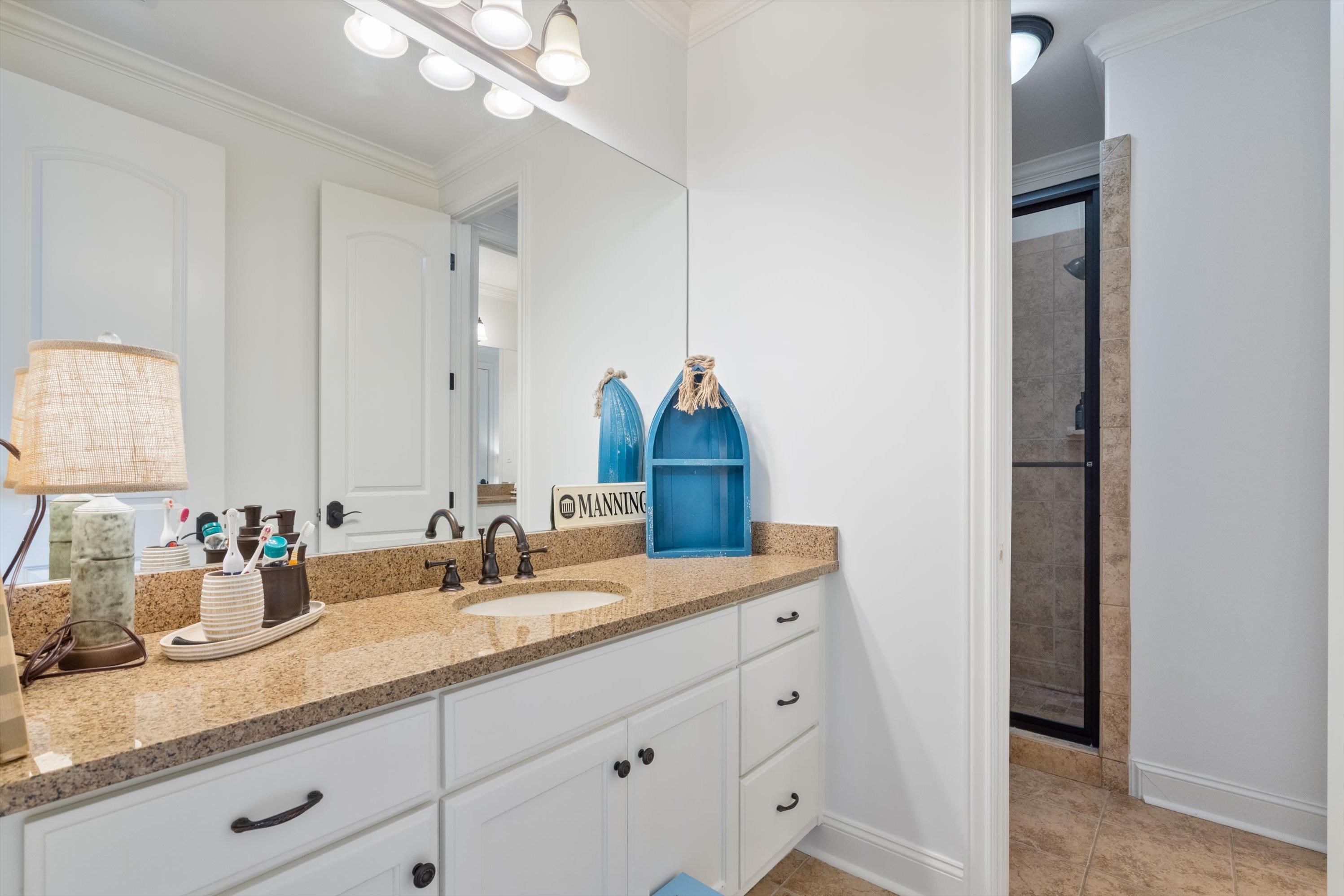 4621 Spring Meadow Way North Olive Branch, MS 38654 - Photo 28 of 40 a bathroom with a sink and a mirror