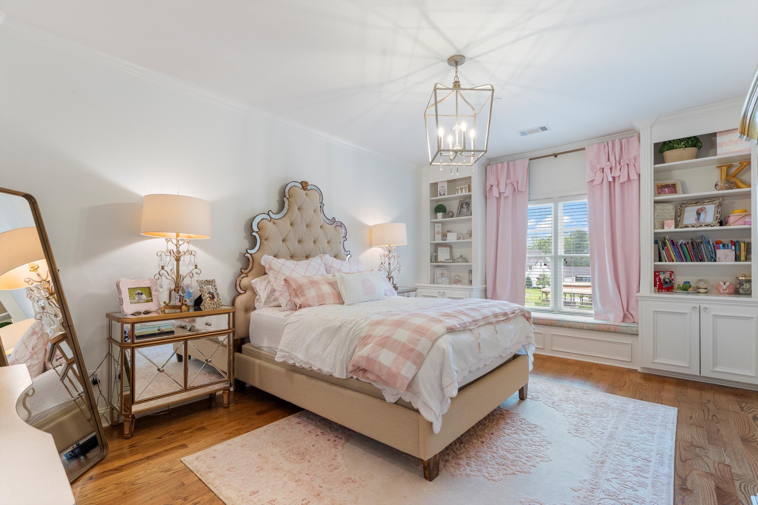 4621 Spring Meadow Way North Olive Branch, MS 38654 - Photo 29 of 40 a bed room with a bed and a chandelier