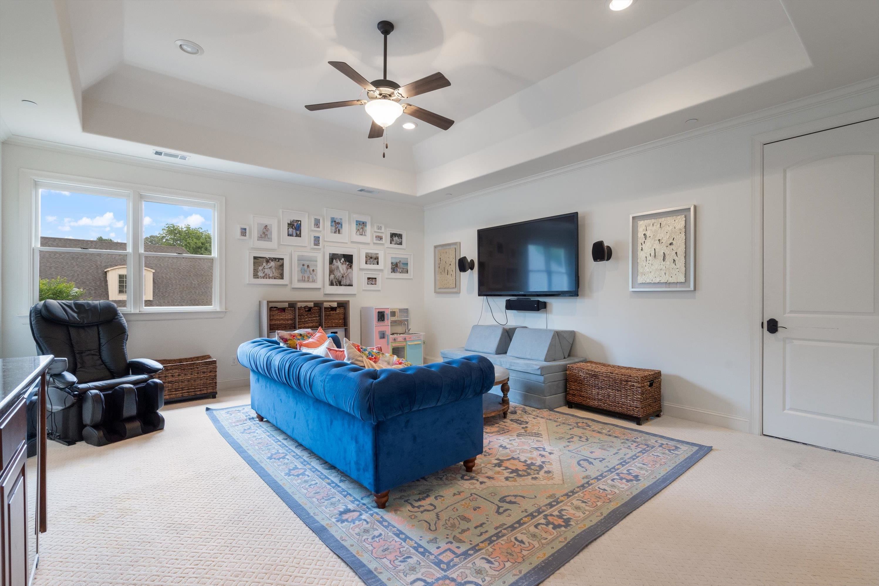 4621 Spring Meadow Way North Olive Branch, MS 38654 - Photo 30 of 40 a living room with furniture and a flat screen tv