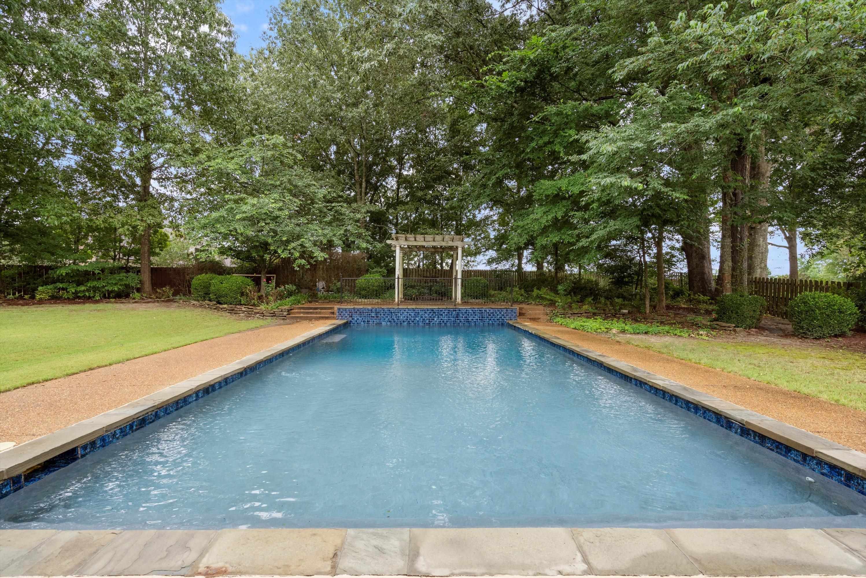 4621 Spring Meadow Way North Olive Branch, MS 38654 - Photo 33 of 40 a view of a backyard with swimming pool