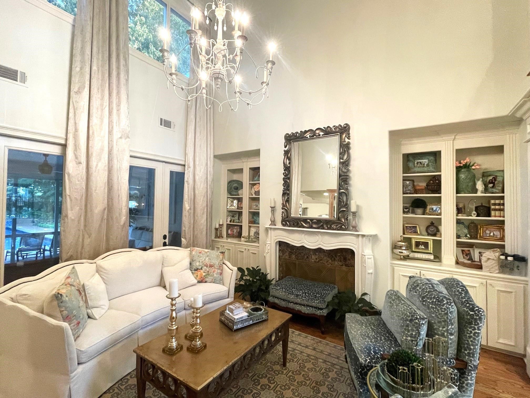 4621 Spring Meadow Way North Olive Branch, MS 38654 - Photo 8 of 40 a living room with furniture a fireplace and a large window