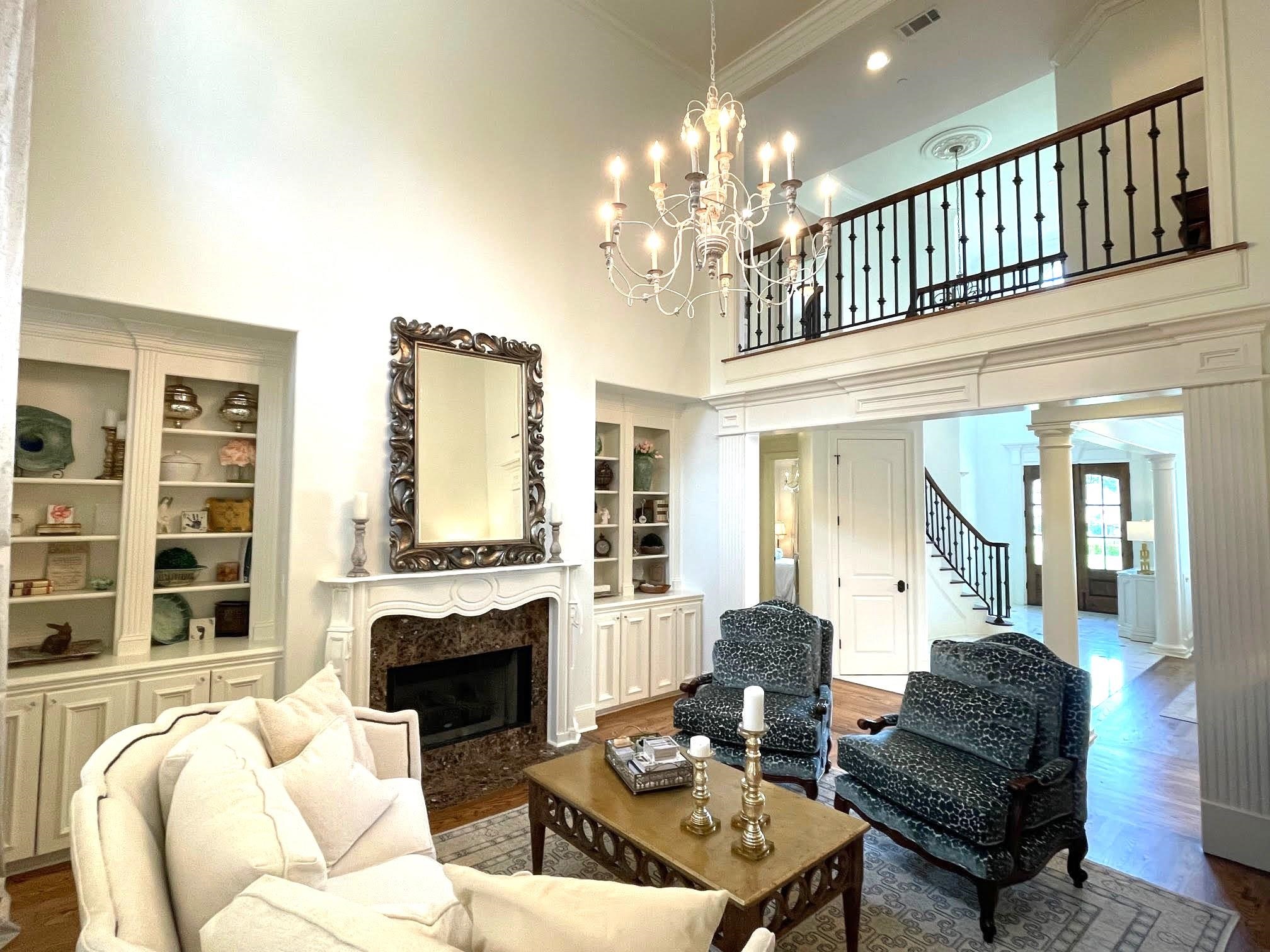 4621 Spring Meadow Way North Olive Branch, MS 38654 - Photo 40 of 40 a living room with furniture a fireplace and a chandelier