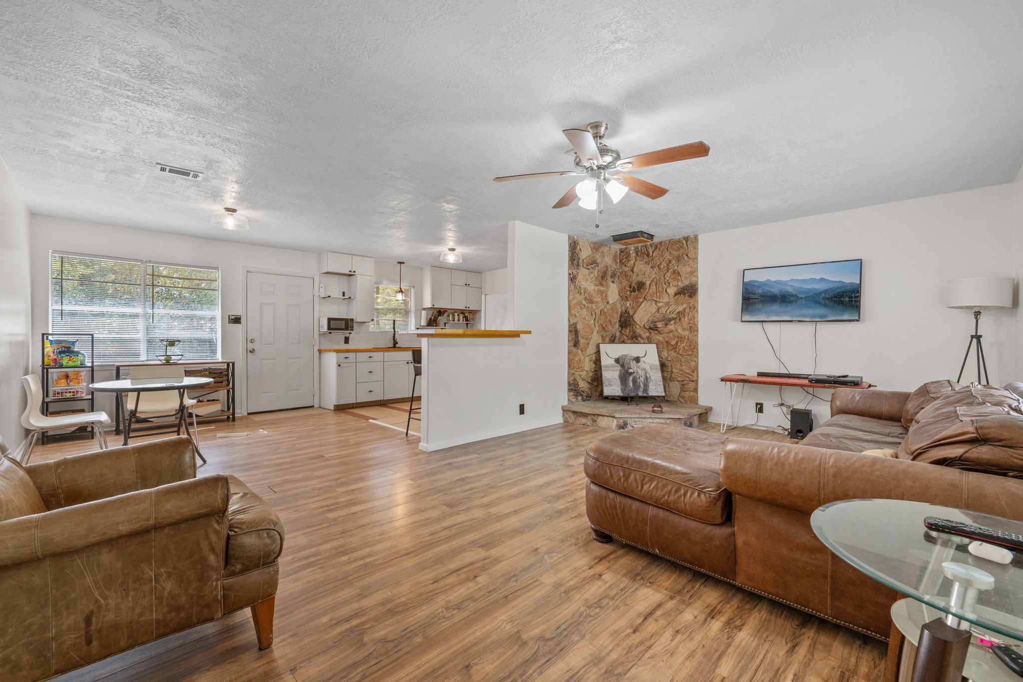 6470 Farm To Market Road 356 Trinity, TX 75862 - Photo 4 of 26 Entry begins with a spacious family room. Large windows for tons of natural light and a stone area ready for a wood burning stove.