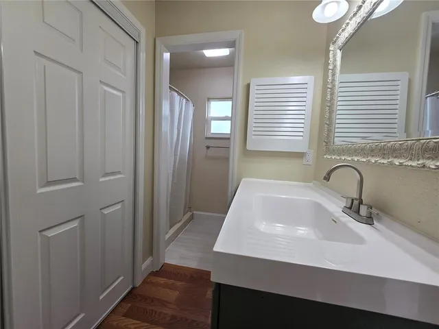 a bathroom with a sink and a mirror