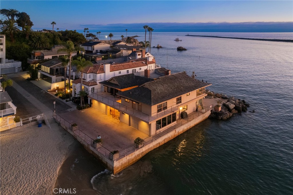 a view of a ocean with chairs