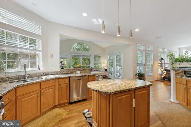 a kitchen with center island and windows