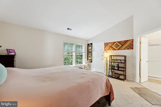 a bedroom with a bed and a closet