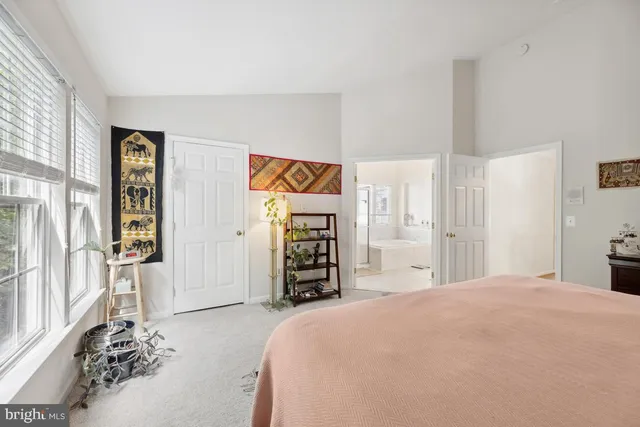 a bedroom with a large bed and a closet