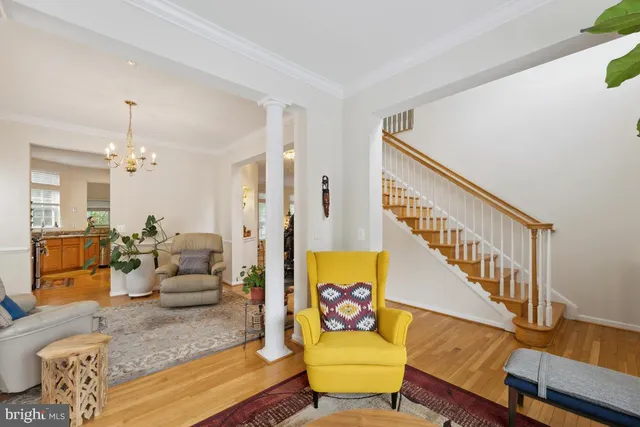 a living room with furniture and a dining table