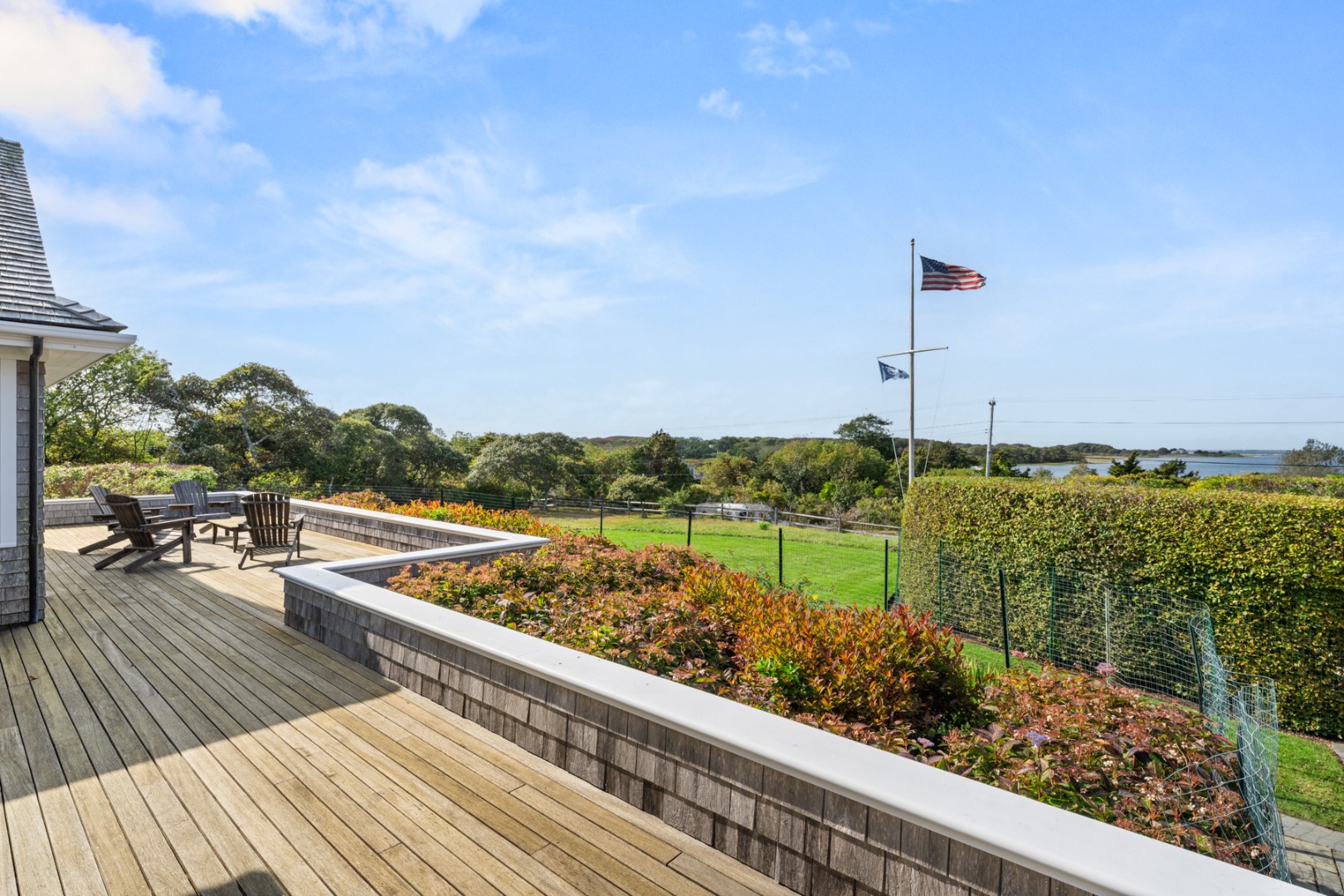 247 Polpis Road Nantucket, MA 02554 - Photo 4 of 52 a view of a terrace with wooden floor and outdoor seating