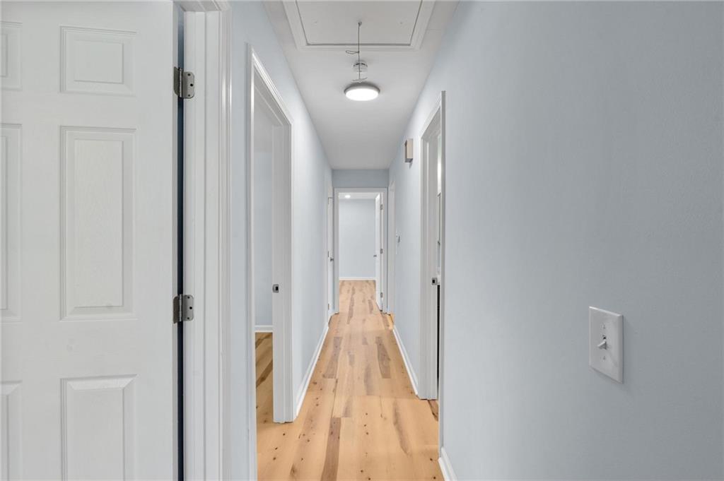 1745 Rockbridge Road Northwest Conyers, GA 30012 - Photo 14 of 32 a view of a hallway with a wooden door