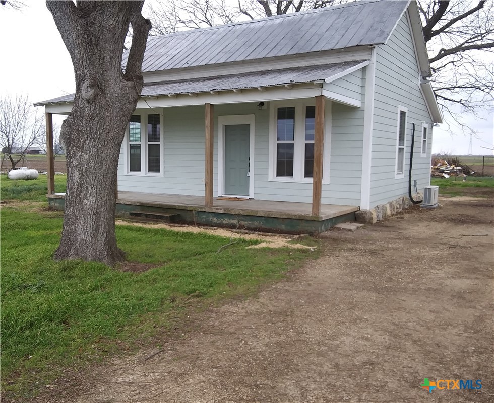 a view of house with yard