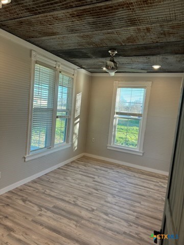 7830 Barbarosa Road New Braunfels, TX 78130 - Photo 12 of 14 a view of empty room with wooden floor and fan