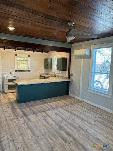 7830 Barbarosa Road New Braunfels, TX 78130 - Photo 3 of 14 a view of kitchen with stainless steel appliances wooden floor and window