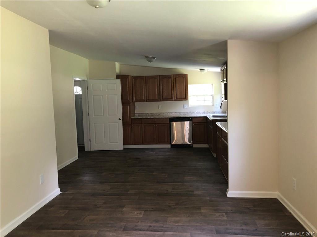 1785 Doe Court Iron Station, NC 28080 - Photo 4 of 14 a view of a kitchen with a sink and a stove top oven