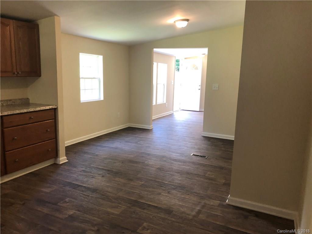1785 Doe Court Iron Station, NC 28080 - Photo 7 of 14 an empty room with wooden floor and windows