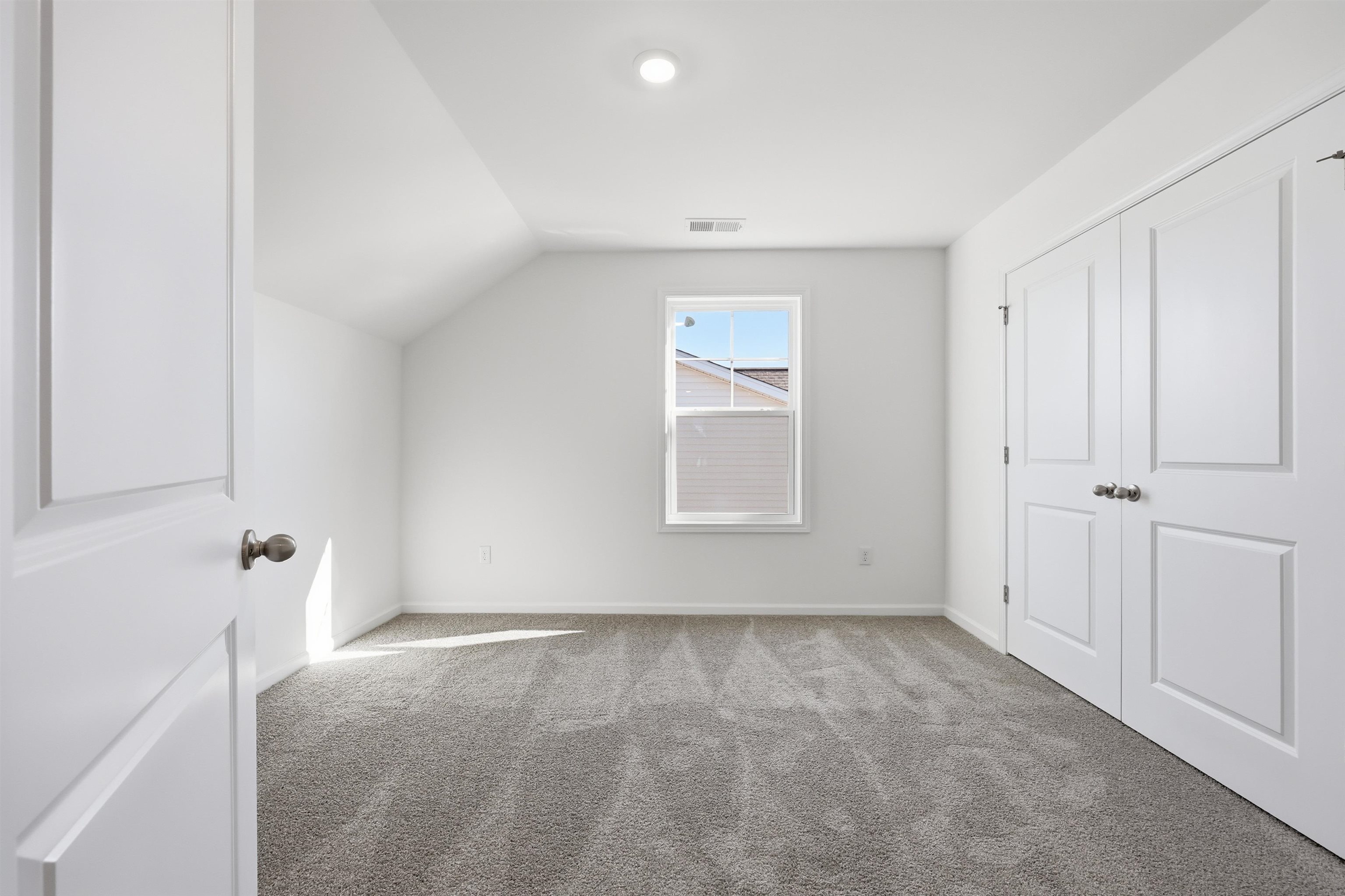150 River Birch Drive Loris, SC 29569 - Photo 19 of 39 Additional living space featuring carpet and vaulted ceiling