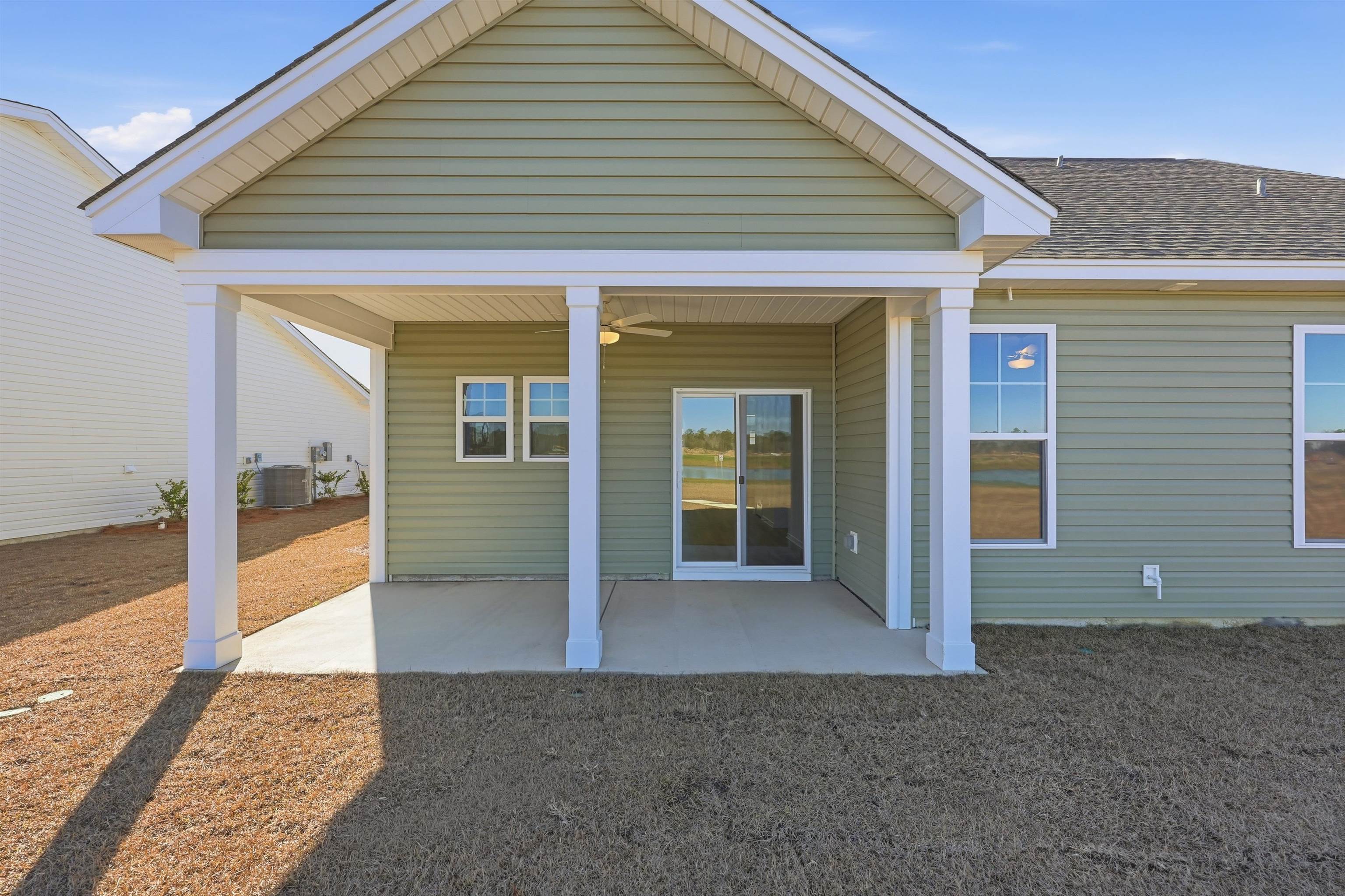 150 River Birch Drive Loris, SC 29569 - Photo 23 of 39 Rear view of house featuring a patio and ceiling fan