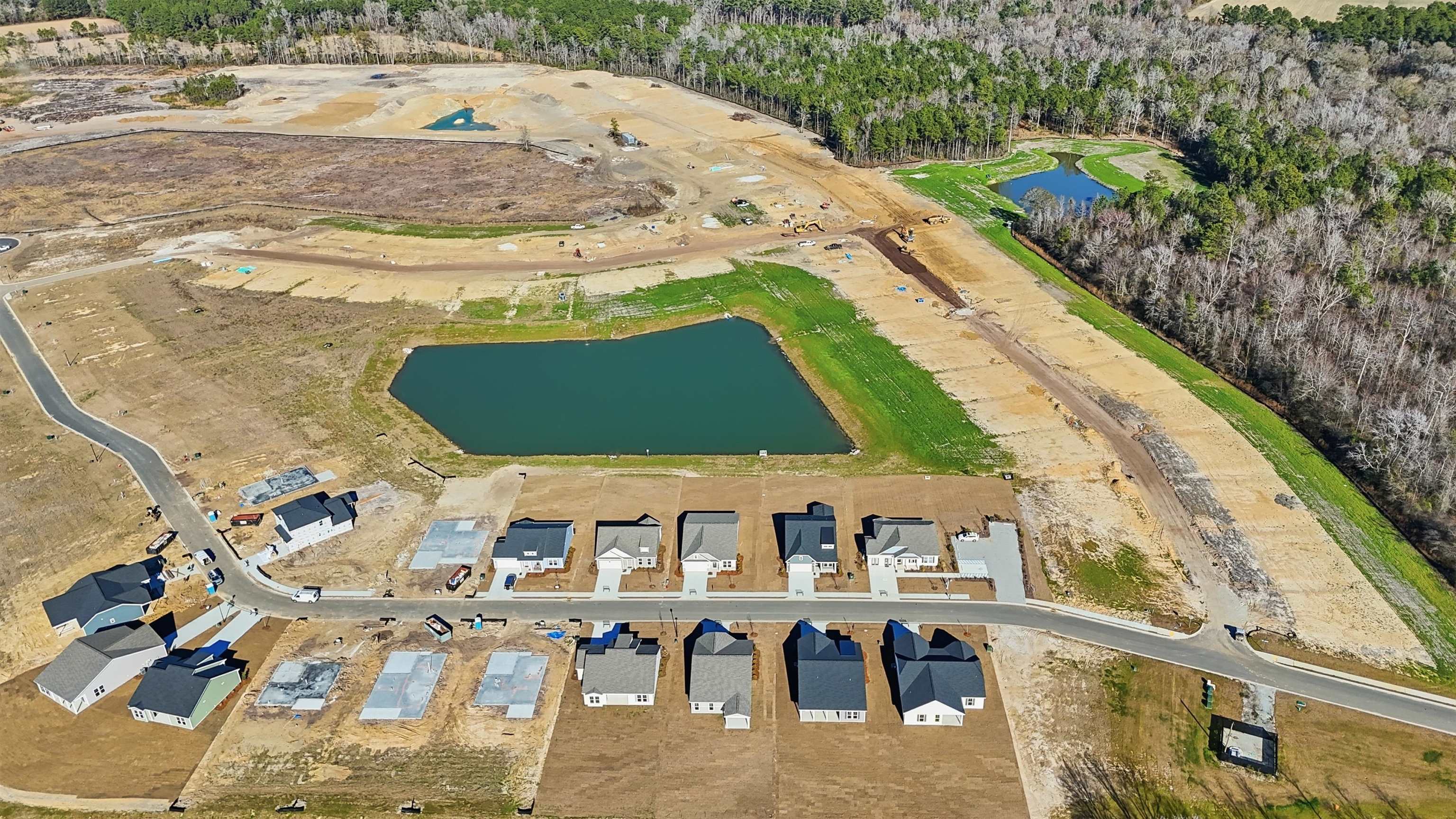 150 River Birch Drive Loris, SC 29569 - Photo 25 of 39 Aerial view of property and surrounding area featuring a nearby body of water and a forest