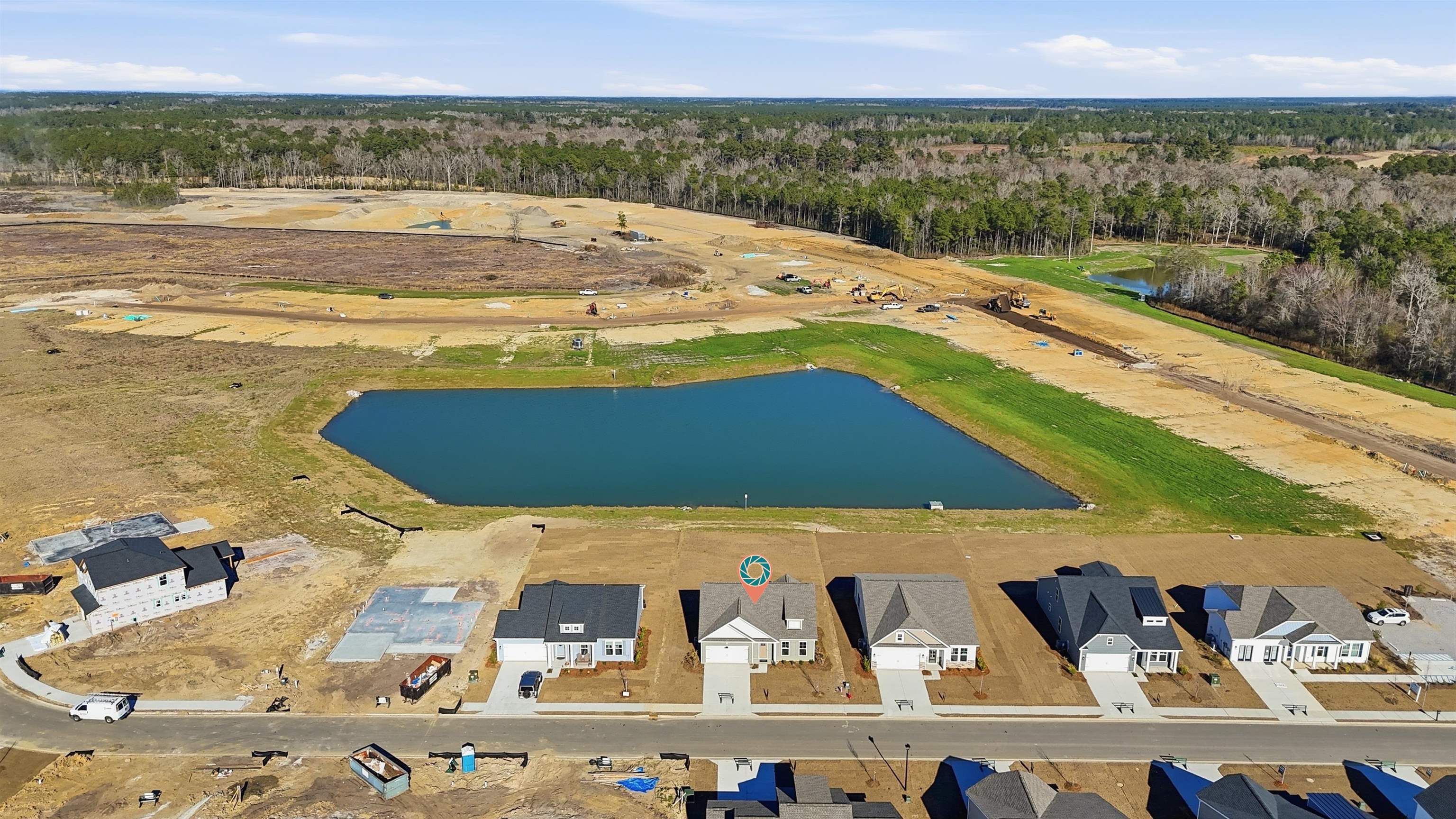 150 River Birch Drive Loris, SC 29569 - Photo 27 of 39 Aerial view of property's location with a large body of water and nearby suburban area