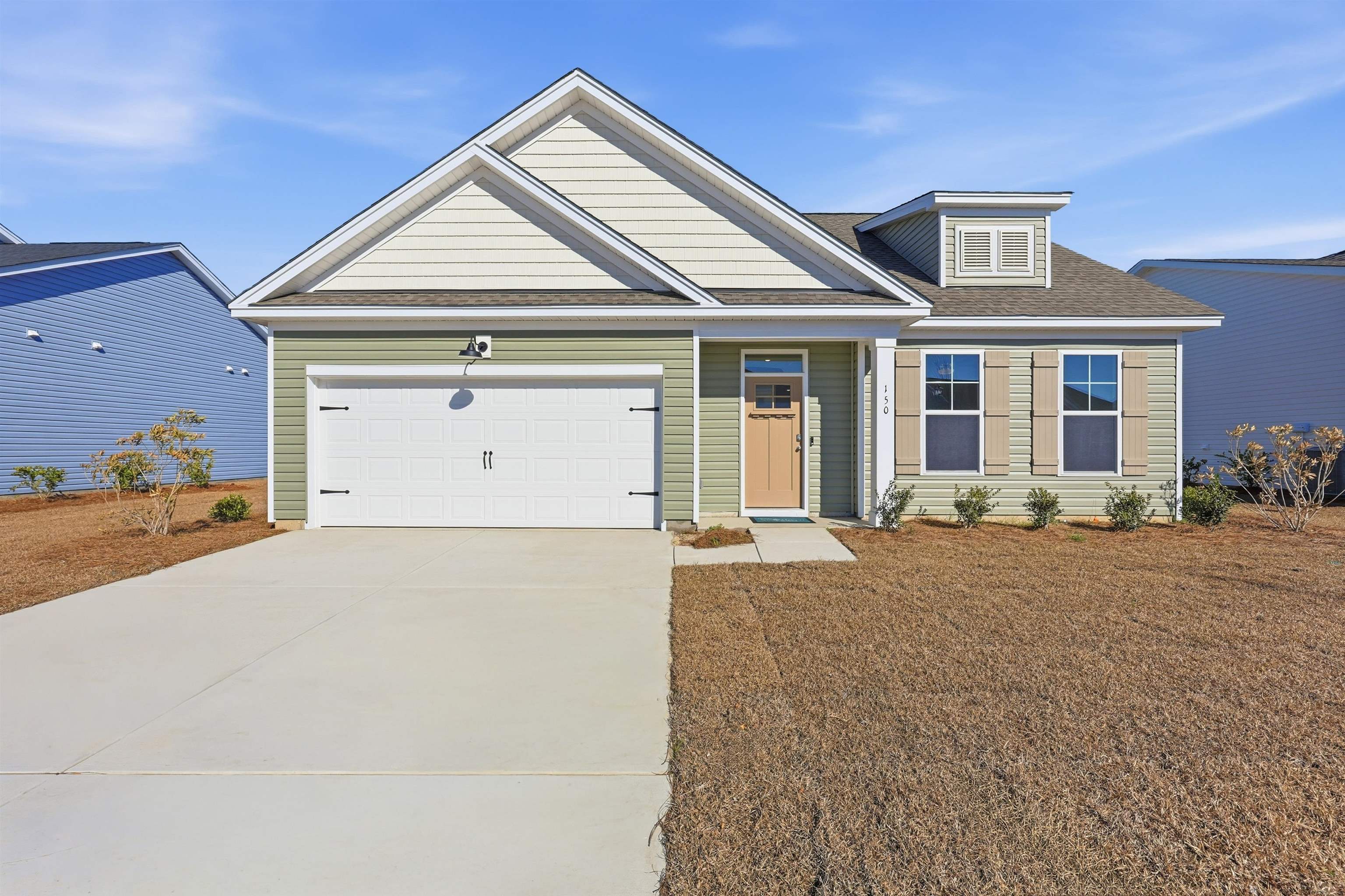 150 River Birch Drive Loris, SC 29569 - Photo 29 of 39 View of front facade with a shingled roof, concrete driveway, and an attached garage