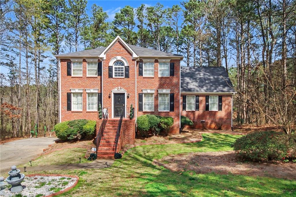 60 Post Oak Trace Villa Rica, GA 30180 - Photo 1 of 34 a front view of a house with a yard